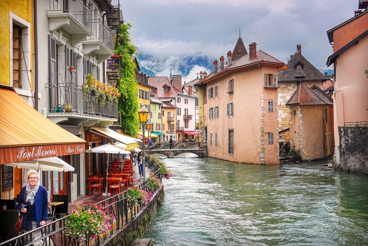 Charming canal with colorful houses and café terraces in Annecy, near Lyon, France