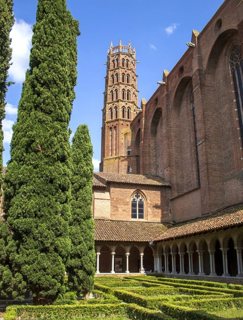 Cloister of the Jacobins Monastery in Toulouse with its gothic tower and garden