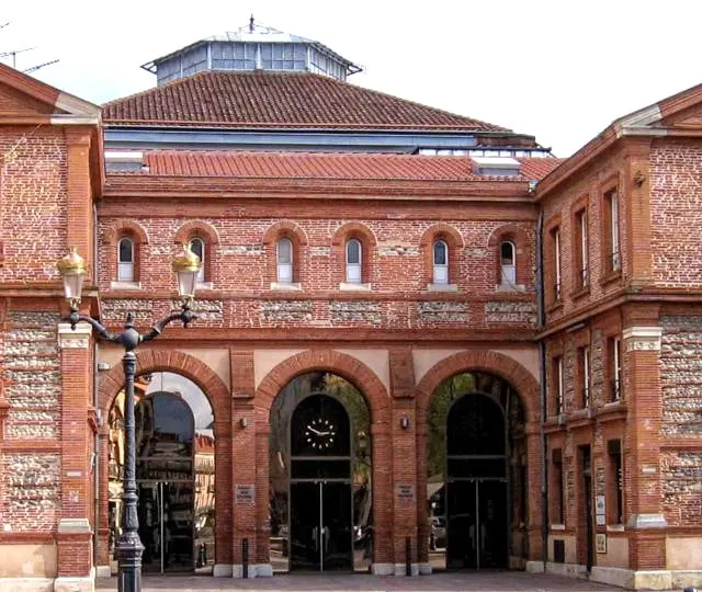 Front entrance of José Cabanis Media Library in Toulouse, France, with red brick architecture