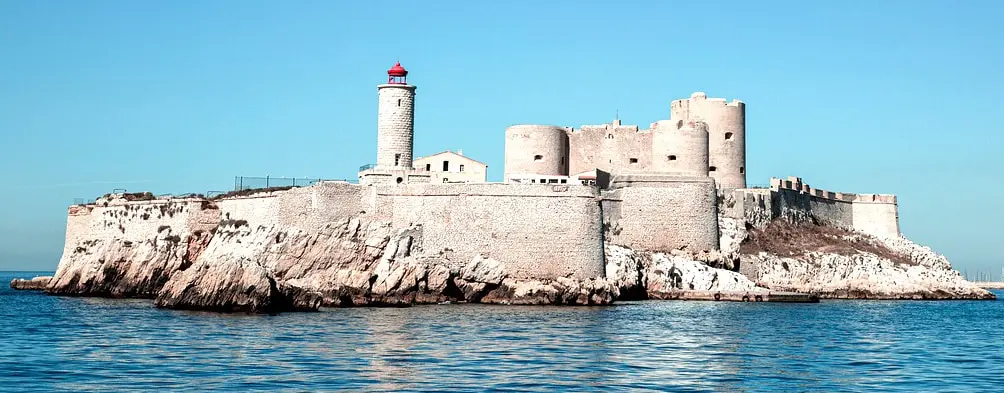 Historic Château d’If fortress on a rocky island off the coast of Marseille, France, under a clear blue sky