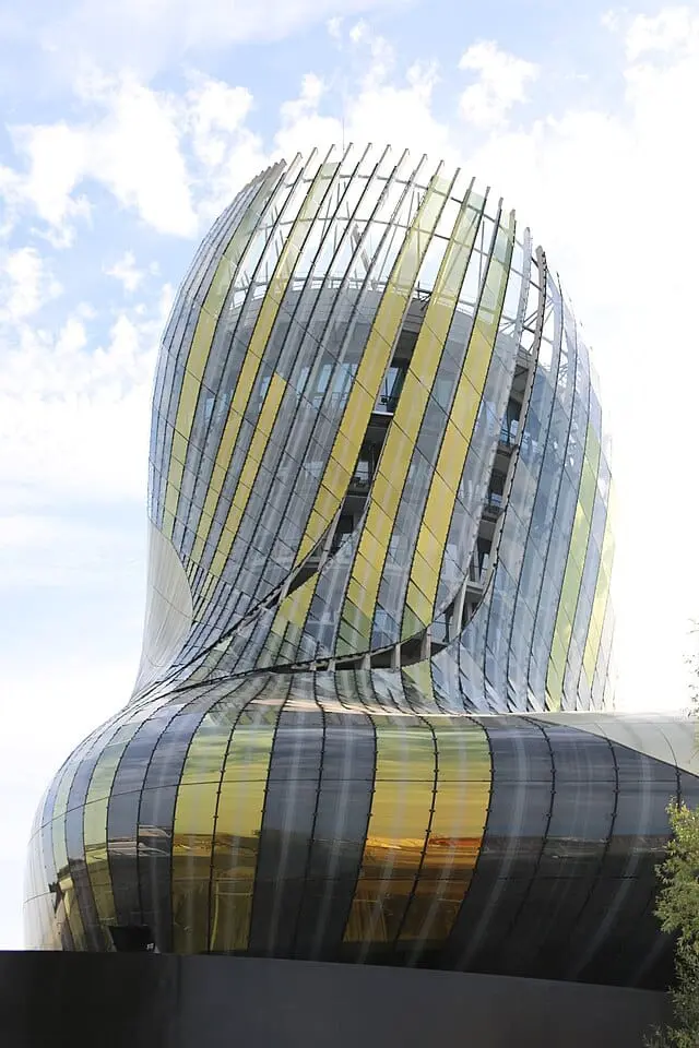 Modern curved glass facade of La Cité du Vin in Bordeaux – contemporary wine museum