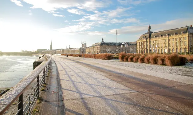 Morning view of Bordeaux waterfront and historical buildings – ideal location for learning French in France