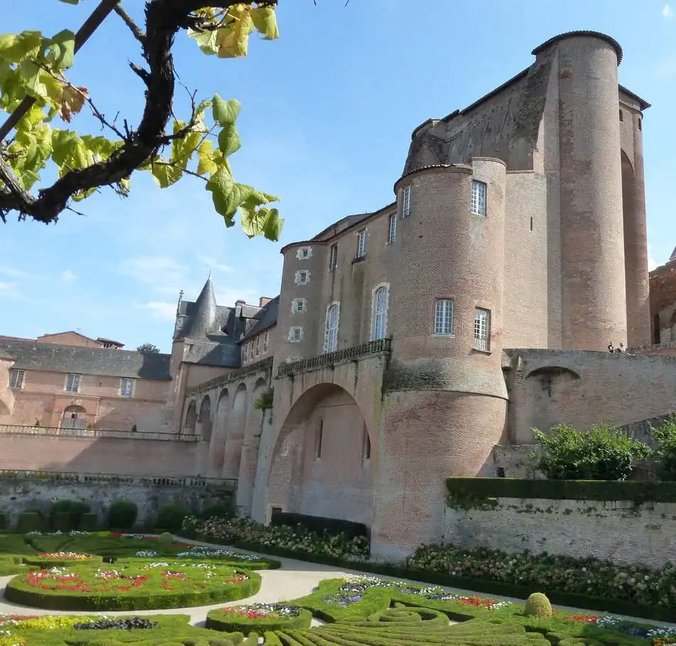 Palais de la Berbie in Albi with French formal gardens and historic red brick architecture near Toulouse