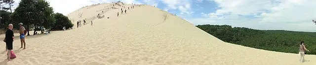 People climbing the Dune du Pilat near Bordeaux, France