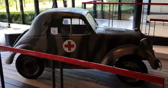 Small Red Cross vehicle used during World War II on display at the Caen Memorial Museum