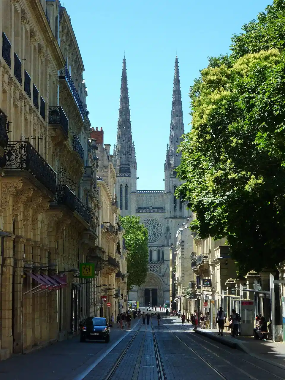 Street view of Bordeaux Cathedral with tram tracks, ideal spot to study French in France