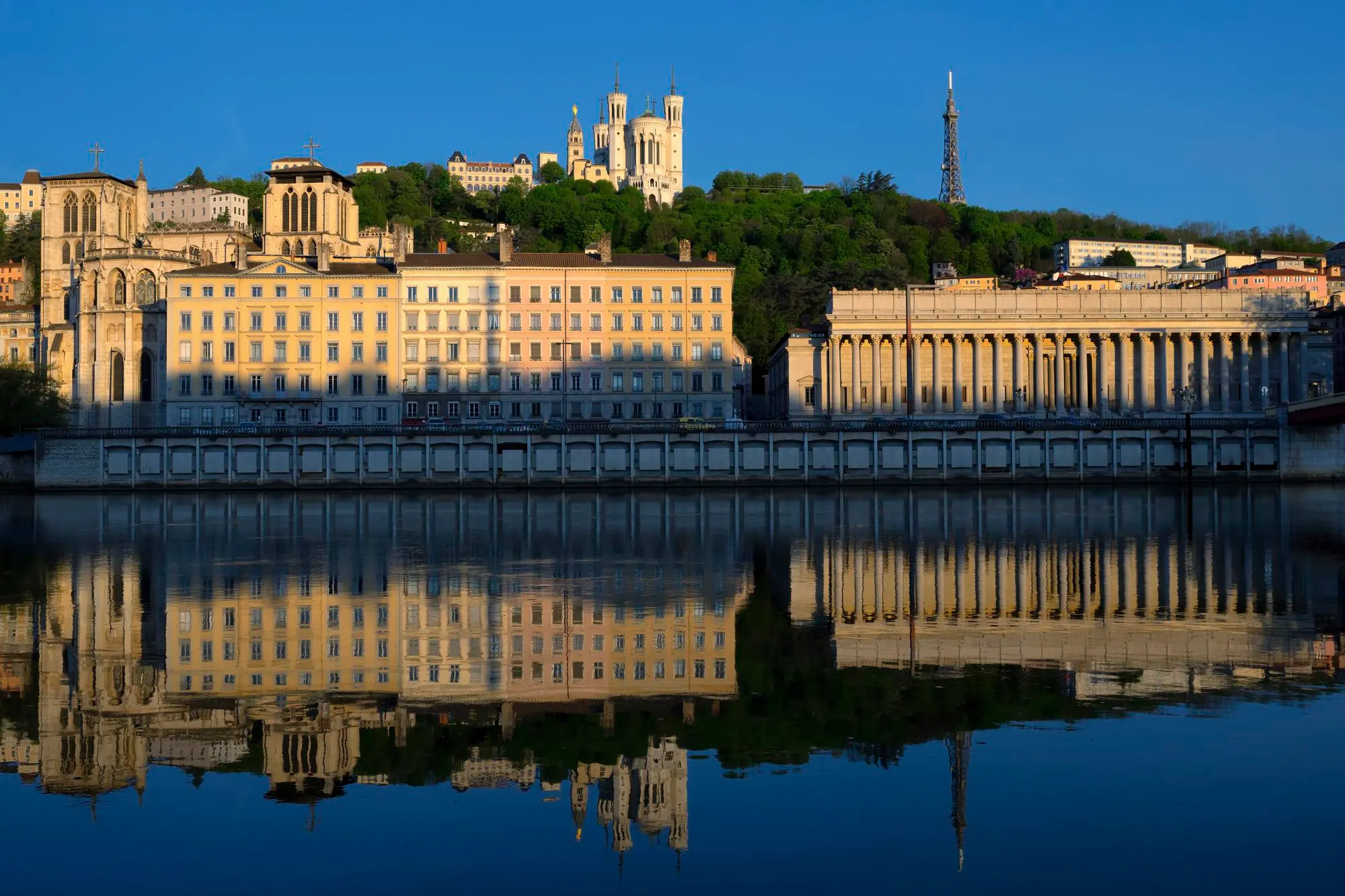 View of Fourvière Basilica and the Law Court of Lyon reflecting in the Saône River – Study French in a city full of history and beauty