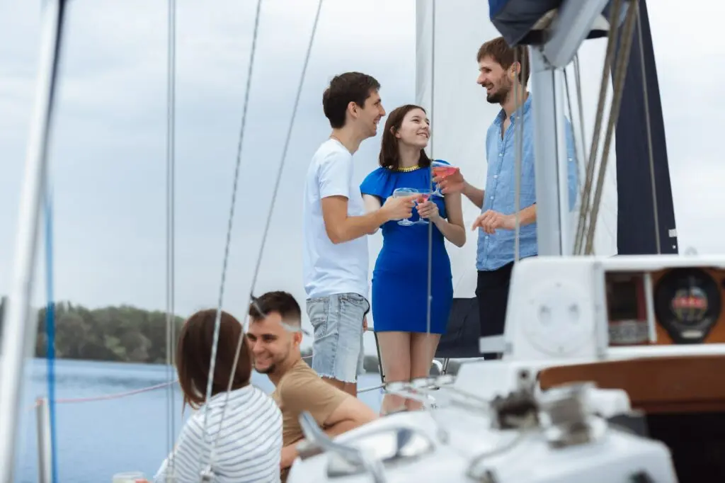 Group of young adults enjoying a boat party near Nice, France