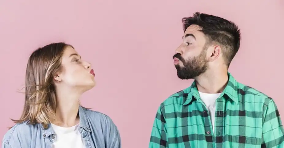 Two people greeting each other with la bise – a typical French social gesture