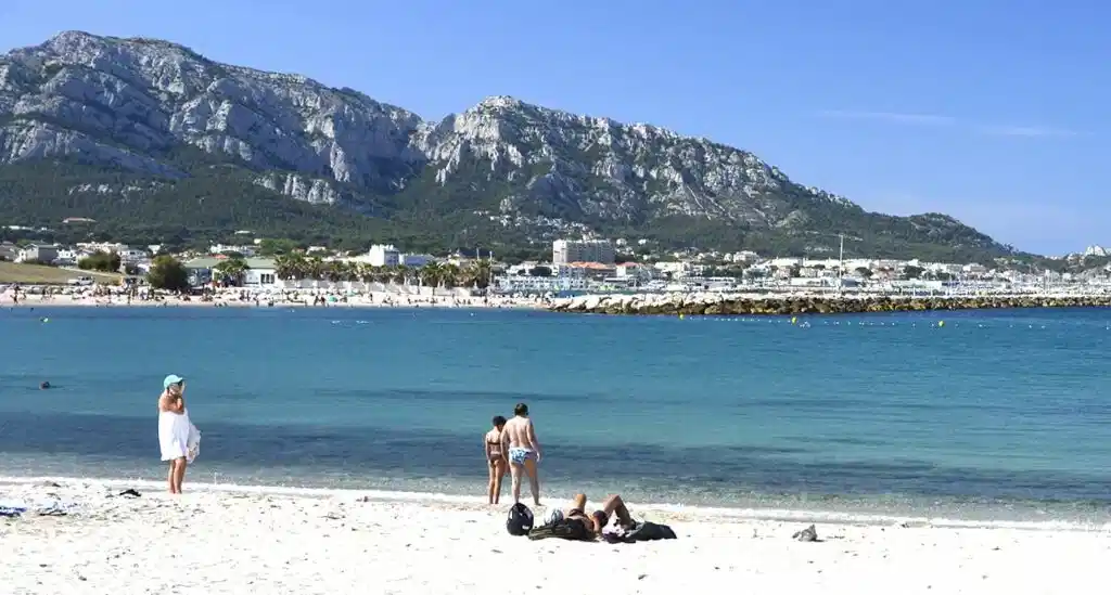 People relaxing on a beach in Marseille, perfect setting for a French language stay in the South of France