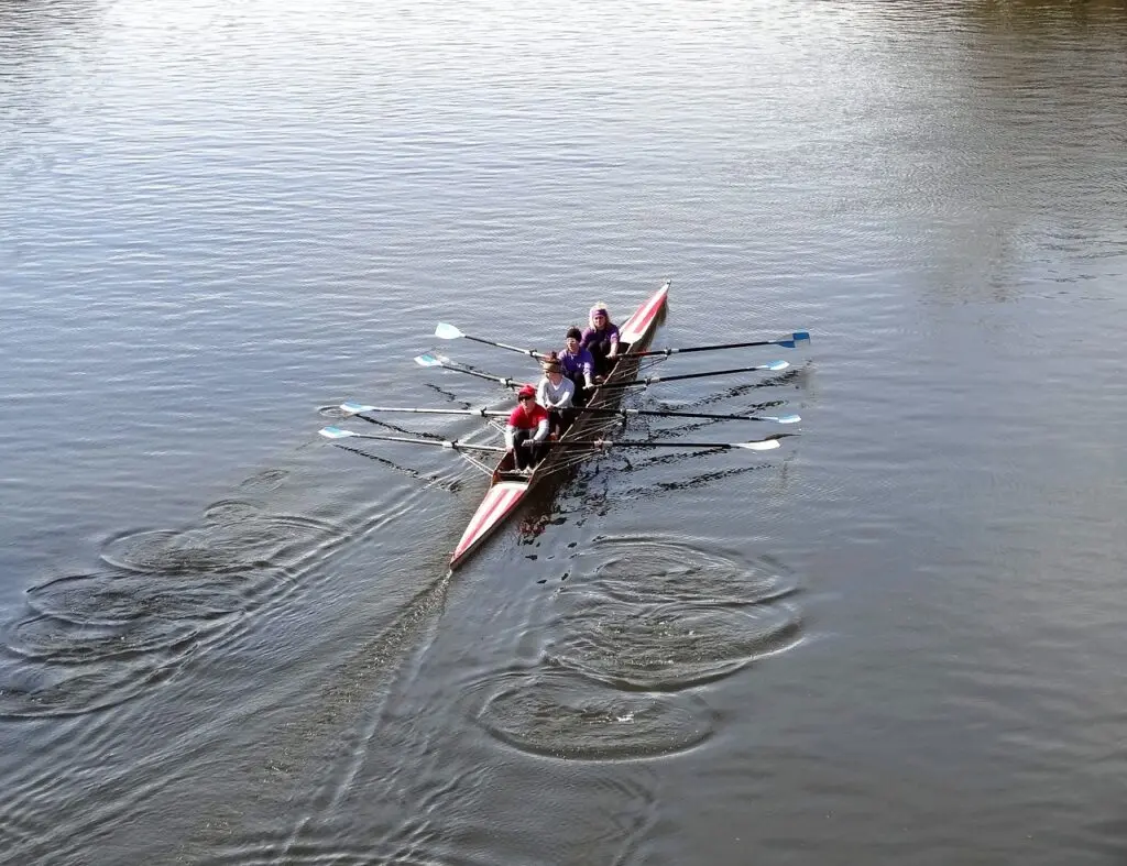 Students rowing on the Seine River during a French language school activity in Paris